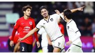 Al Sadd's Bagdad Bounedjah  (centre) celebrates after scoring one of his three goals during yesterday's El Clasico against Al Rayyan at Jassim Bin Hamad Stadium.  