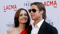Cast member Brad Pitt and actress Angelina Jolie pose at the premiere of 