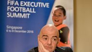 FIFA President Gianni Infantino attends a media briefing after the Fifa Executive Football Summit in Singapore on December 8, 2016. AFP / Roslan RAHMAN
