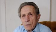 This file photo taken on February 23, 2007 shows Czech Adolf Burger, 89, a former prisoner in the Sachsenhausen concentration camp, showing his book 