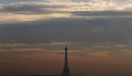 A small-particle haze hangs above the Eiffel Tower, that is seen on the horizon from Suresnes, near Paris, France, December 8, 2016. REUTERS/Christian Hartmann