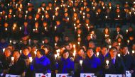 Lawmakers and members of South Korea's Democratic Party hold candles at a protest urging the impeachment of President Park Geun-hye at the National Assembly, in Seoul