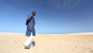 Gambian national Ebrima Sanneh, who has been in exile since 2013, walks on a beach in Dakar, Senegal, December 5, 2016. REUTERS/Mikal McAllister