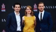 Actors Emma Stone and Ryan Gosling pose with writer and director Damien Chazelle (L) at their Hand and Foot prints ceremony in front of the TCL Chinese Theater in Hollywood on December 7, 2016 ahead of the release of the film LA LA Land set for December 9