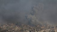Smoke rises from a rebel-held area of Aleppo, Syria December 9, 2016. REUTERS/Abdalrhman Ismail

