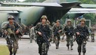 US-trained Philippine Army troops arrive in Jolo island for deployment against Abu Sayyaf rebels on August 24, 2002, as part of a government campaign that over decades has weakened but not eliminated the movement (AFP Photo/Romeo Gacad)
