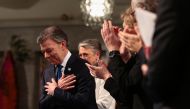 Nobel Peace Prize laureate Colombian President Juan Manuel Santos is applauded during the Nobel Peace Prize award ceremony at the City Hall in Oslo on December 10, 2016. Colombian President Juan Manuel Santos was awarded this year's Nobel Peace Prize for 