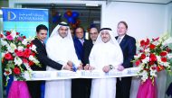 Qatar's Ambassador to Bangladesh, Ahmed Mohamed Al Dehaimi (second left) cutting the ribbon to mark the official inauguration of the Doha Bank's representative office in Dhaka.