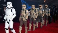 Stormtrooper characters march down the red carpet at the premiere of Walt Disney Pictures and Lucasfilm's 