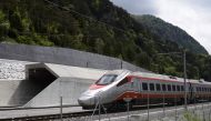 This file photo taken on May 31, 2016 shows an Italian train making its way at the north entrance of the new Gotthard Base Tunnel, the world's longest train tunnel, on the eve of its inauguration in Erstfeld.
Regular rail service through the world's long
