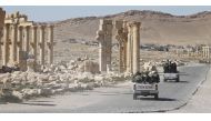 Syrian army soldiers drove through the historic city of Palmyra in April. PHOTO: REUTERS.