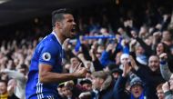Chelsea's Brazilian-born Spanish striker Diego Costa celebrates after scoring the opening goal of the English Premier League football match between Chelsea and West Bromwich Albion at Stamford Bridge in London on December 11, 2016.  AFP / Justin TALLIS