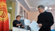 Kyrgyzstan's President Almazbek Atambayev casts his ballot during a referendum on the constitution in Bishkek on December 11, 2016. Citizens in ex-Soviet Kyrgyzstan went to the polls to vote on a raft of amendments to the constitution promoted by the coun