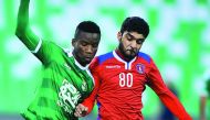 Al Ahli Gnuessan Kissito (left) and Al Shahaniya's Nabeel Mohammad vie for ball possession during the Qatar Stars League (QSL) match at Al Ahli stadium yesterday. The match ended in an one-all draw.Pics by: Baher Amin/The Peninsula