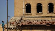 An Egyptian man looks at the damage at the scene of a bomb explosion that targeted the Saint Peter and Saint Paul Coptic Orthodox Church on December 11, 2016, in Cairo's Abbasiya neighbourhood.  AFP / SUHAIL SALEH