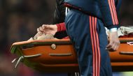 Manchester United's Armenian midfielder Henrikh Mkhitaryan is taken off on a stretcher after picking up an injury during the English Premier League football match between Manchester United and Tottenham Hotspur at Old Trafford in Manchester, north west En