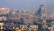 Smoke rises as seen from a government-held area of Aleppo, Syria December 12, 2016. REUTERS/Omar Sanadiki