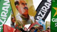 People wave flags with pictures of imprisoned Kurdish rebel leader Abdullah Ocalan during a May Day rally in Istanbul, Turkey, May 1, 2016 (REUTERS / Murad Sezer) 