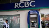 A security guard stands guard outside a branch of Rizal Commercial Banking Corporation (RCBC) in Paranaque city, Metro Manila, Philippines August 2, 2016. REUTERS/Erik De Castro