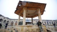 Forces loyal to Syria's President Bashar al-Assad stand inside the Umayyad mosque, in the government-controlled area of Aleppo, during a media tour, Syria December 13, 2016. REUTERS/Omar Sanadiki 