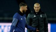 Real Madrid's Sergio Ramos talks with head coach Zinedine Zidane during a training session ahead of FIFA Club World Cup Semi-Final match against Club America. REUTERS/Issei Kato
