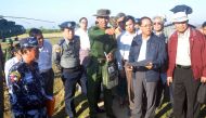 This handout photograph taken on December 12, 2016 and released on December 13, 2016 by the Myanmar State Counsellor Office shows a military official (C) briefing Myanmar Vice President Myint Swe (2nd R, in blue jacket), head of the Rakhine State Investig