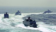 Taiwan navy fast attack boats take part in a military drill outside a naval base in Kaohsiung port, southern Taiwan, recently.