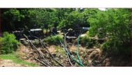 Engine-driven water pumps pull water from a storage tank intended for animals in southern Sri Lanka. TRF/Amantha Perera
