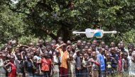 Children in Malawi look on during a community demonstration of drones in Lilongwe, Malawi, on March 12, 2016. Photos by UNICEF