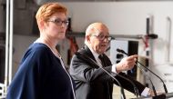 France's Minister of Defence Jean-Yves Le Drian (R) gestures beside his Australian counterpart Marise Payne as they address the media on the hangar deck of the HMAS Adelaide in Sydney on December 19, 2016. AFP / William West