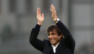 Chelsea's Italian head coach Antonio Conte applauds the fans following the English Premier League football match between Crystal Palace and Chelsea at Selhurst Park in south London on December 17, 2016.  AFP / Adrian DENNIS 