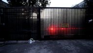 Flowers are left near the door of Russian Embassy in Turkey as security measurements are tighten in Ankara, Turkey on December 20, 2016. Metin Aktas - Anadolu Agency 