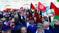 Tunisians gather in front of the Municipal Theatre during a protest against the assassination last week of Tunisian national Mohammed Zawari, who Palestinian Hamas group said was one of its drone experts, in Tunis, Tunisia December 20, 2016. REUTERS/Zoube