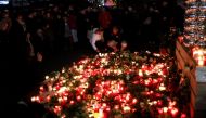 Candles burn at a Christmas market at Breitscheidplatz in Berlin, Germany, December 20, 2016, to commemorate the 12 victims of a truck that ploughed into the crowded market. REUTERS/Hannibal Hanschke
