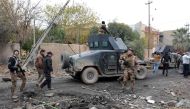 Iraqi special forces gather next to their armoured vehicles in the neighbourhood of al-Barid, east of Mosul, on December 18, 2016 during their ongoing operation against Islamic State (IS) group jihadists to wrest back the city. / AFP / Mahmoud AL-SAMARRAI