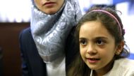 Syrian Bana Alabed (R), a seven-year-old girl who tweeted about the attacks in Aleppo, speaks to media with her family after she met with Turkish President Recep Tayyip Erdogan in Ankara, Turkey on December 21, 2016. ( Emre ?eno?lu - Anadolu Agency )
