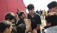 Migrants argue for a box of supplies donated by Greek people on March 11 2016 in a makeshift camp at the Greek-Macedonian border near the Greek village of Idomeni (AFP / DANIEL MIHAILESCU) 
