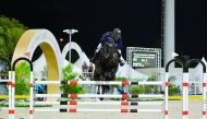 Saudi rider Ramzy Hamad Al Duhami, winner of top prize, in action astride Garlic VH Kapelhof during the opening day of  Qatar International Show Jumping Championship in Doha, Yesterday.  
