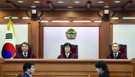 South Korea's Constitutional Court judges (from left) Lee Jin-Sung, Lee Jung-Mi and Kang Il-Won attend a hearing into whether to confirm the impeachment of President Park Geun-Hye, at the Constitutional Court in Seoul, yesterday.