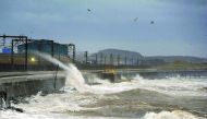 Waves crash onto the traintracks near Saltcoats in Ayrshire, Scotland, as Storm Barbara begins to hit the British coastline