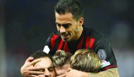 AC Milan's Giacomo Bonaventura (back) celebrates with teammates scoring a goal against Juventus' team during the Italian Super Cup final in Doha yesterday.