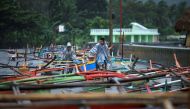 Fishermen secure their boats in the bay of Santo Domingo, Albay province on December 25, 2016, as typhoon Nock-Ten approaches.  AFP / Charism SAYAT
