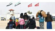 Internally displaced Syrians wait near the Bab al-Salam crossing, opposite the Turkey's Kilis province, on the outskirts of the northern Syrian border town of Azaz on Feb 6, 2016 (Reuters) 