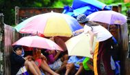 Young residents sit in a truck after the local government implemented preemptive evacuations at Barangay Matnog, Daraga, Albay province on December 25, 2016, due to the approaching typhoon Nock-Ten. Babies, toddlers and old people were loaded onto militar