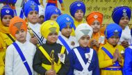 Young Indian Sikhs wait for the judging of a turban tying competition at a school in Amritsar on December 25, 2016. The competition was organized by the Sikh organization, Akal Purakh Ki Fauj to promote greater awareness of the turban. The Turban is close