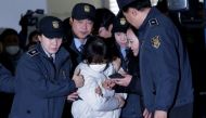 South Korean lawmakers have made fresh efforts to question Choi Soon-sil (C), the jailed confidante of President Park Geun-hye. AFP