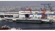A general view shows navy soldiers standing on China's first aircraft carrier 'Liaoning' as it is berthed in a port in Dalian, northeast China's Liaoning province, September 25, 2012. REUTERS/Stringer