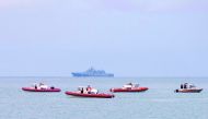 Russian rescue boats patrol off the coast of the Black Sea City of Sochi in search of debris of a Russian military plane, yesterday.