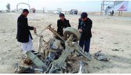 A wreckage of a car is seen after a bomb targeting the convoy of deputy provincial police chief of southern Helmand province exploded in Helmand district, Afghanistan, yesterday.