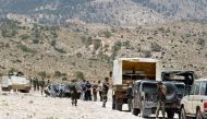 Tunisian soldiers stand guard in the mountainous border region near Algeria where security forces have been hunting Al-Qaeda linked militants on June 6, 2013 (AFP / Abderrazek Khlifi) 